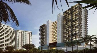 View of Grand Hyatt Cancun Beach Resort, with three modern high-rise buildings with balconies, surrounded by palm trees and greenery, under a clear sky.