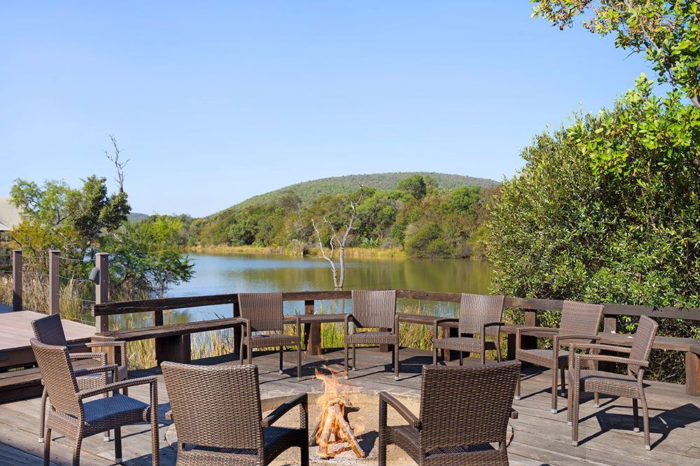 Hippo Lakes Luxury African Safari Lodge luxury safari tent firepit on deck, overlooking the lake