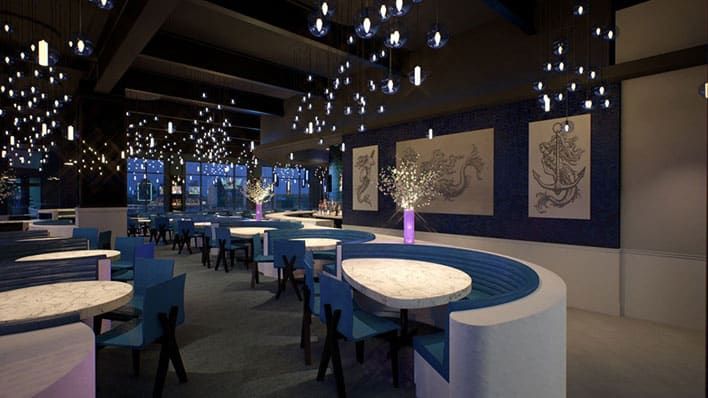 Salt Water Social in Denver, CO. A modern restaurant interior with curved blue booths, marble tables, blue chairs, decorative wall art, and hanging pendant lights. Large windows are visible in the background.