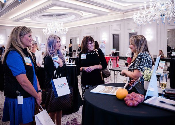 A group of women listening to a destination presentation at a Retreats Resources roadshow.